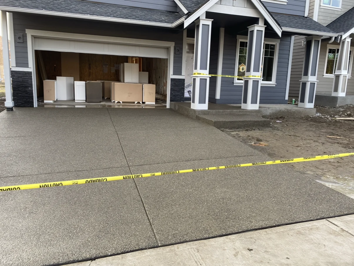 Exposed aggregate driveway and matching front porch steps