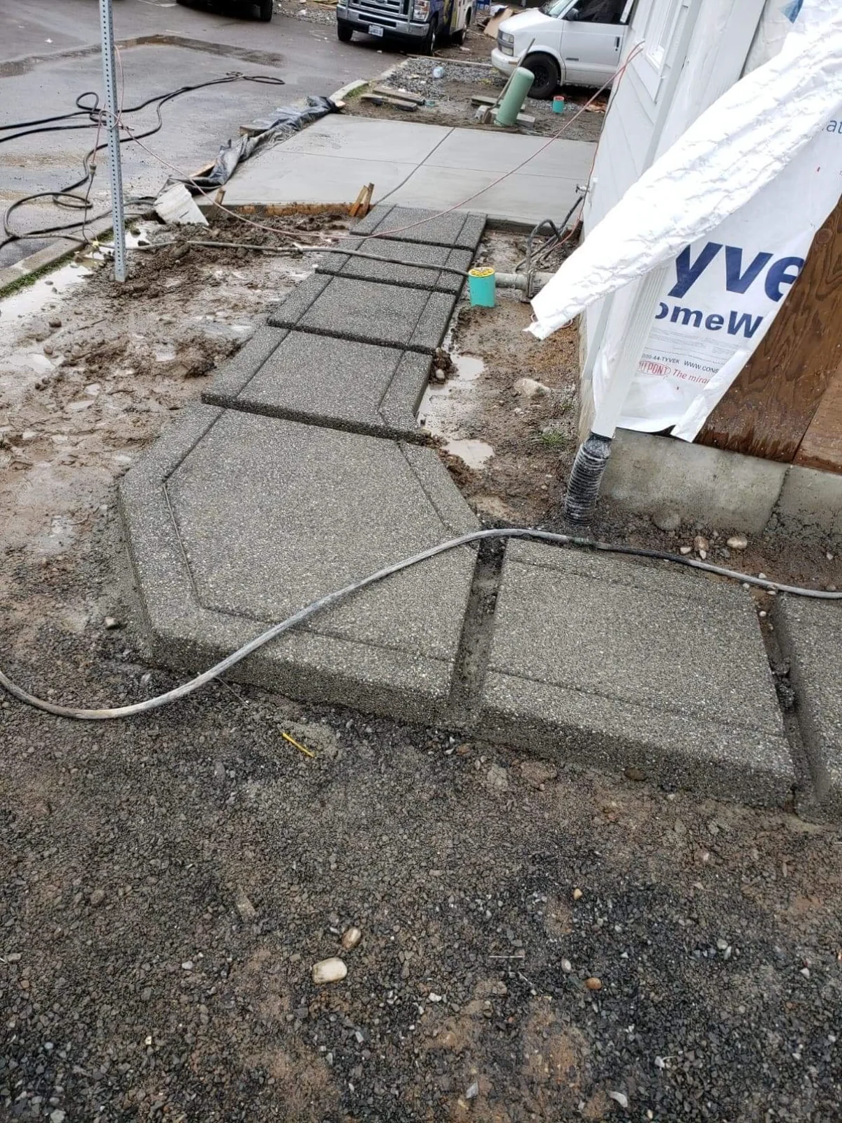 Exposed aggregate entry path with steps and an angled landing