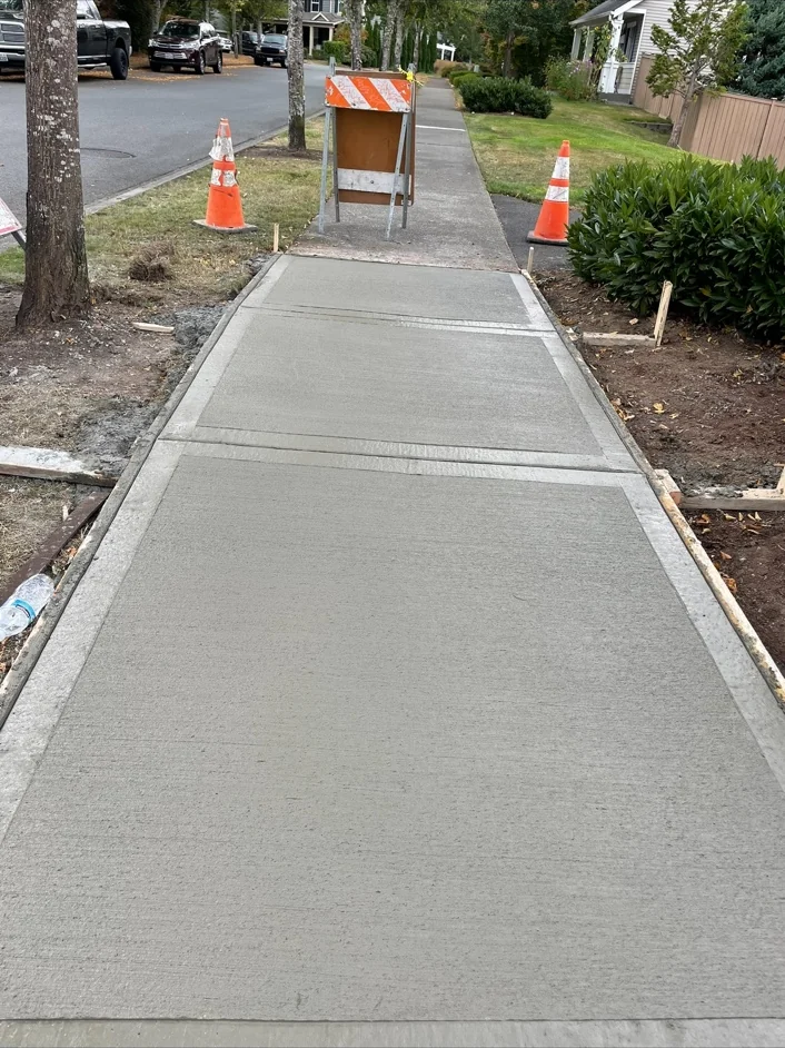 New sidewalk panels beside a residential street