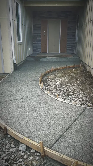 Curved exposed aggregate entry