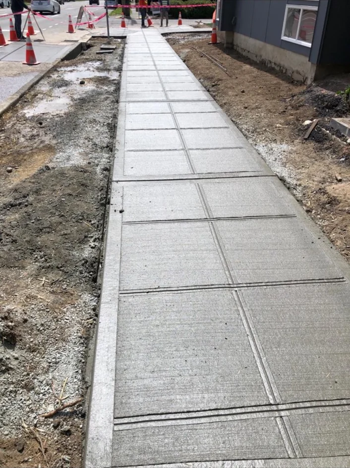 Long concrete walkway divided into evenly spaced panels